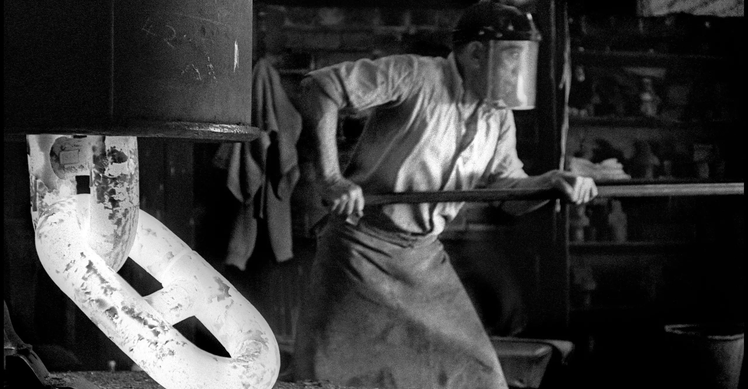 Man working working in an industrial forge 