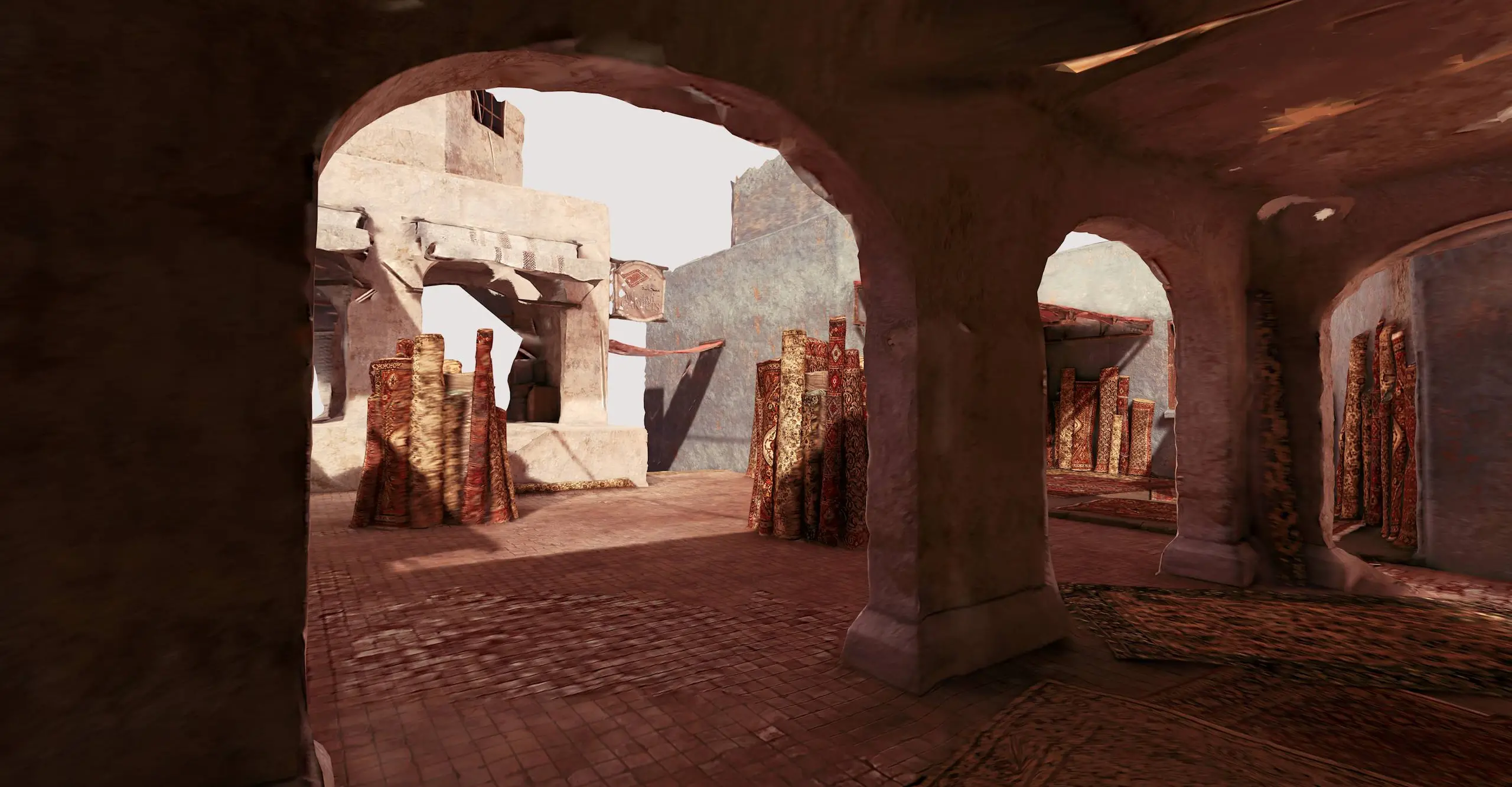 A still image from a 3D rendered view of an ancient looking square with stone archs  