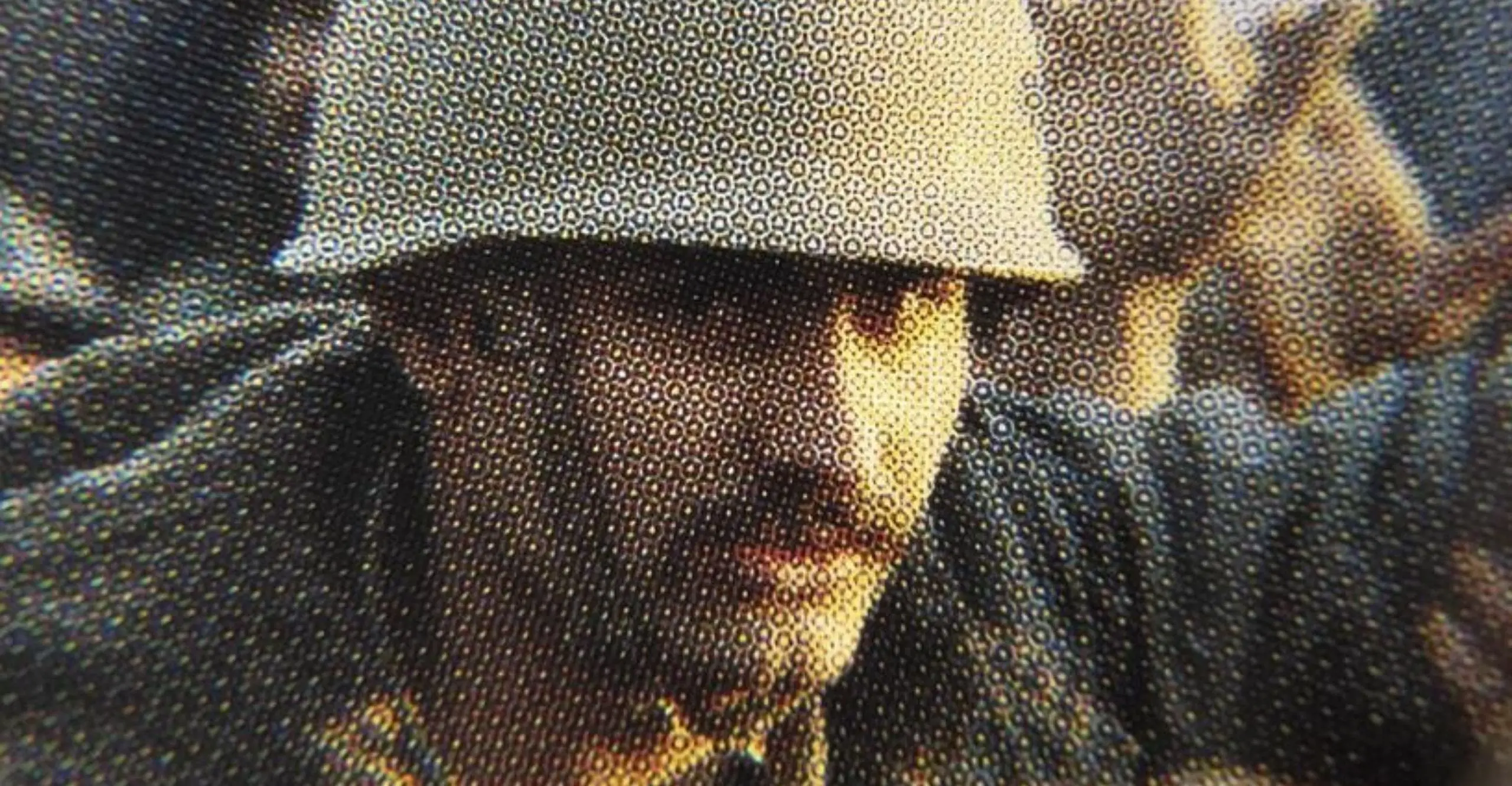 Close up of a person with a moustache wearing an army helmet