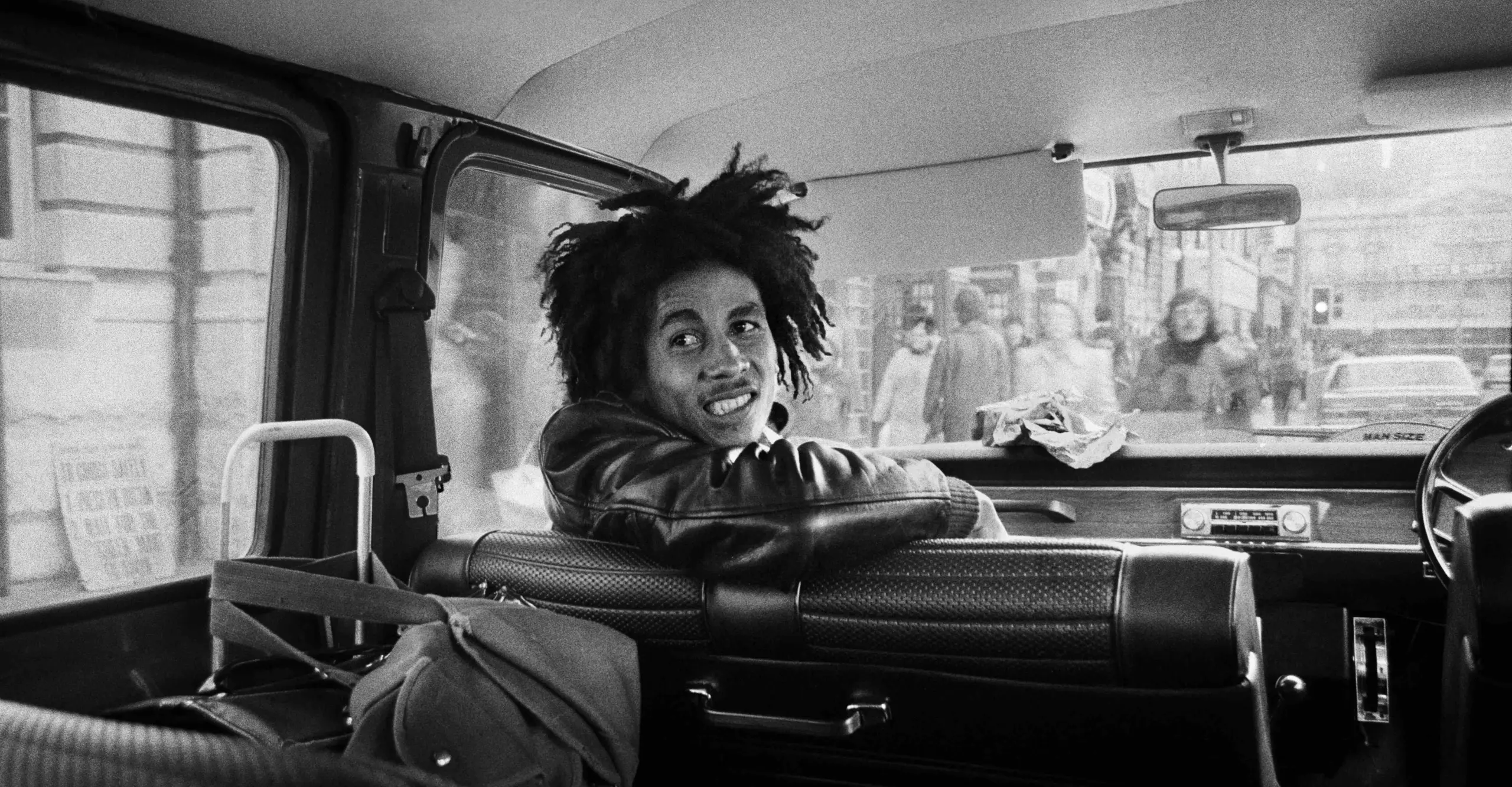 Black and White image of Bob Marley on a tour bus