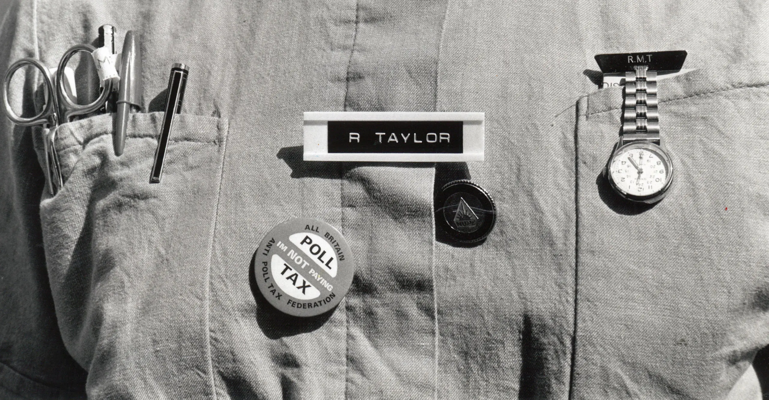 A nurses uniform including a Poll Tax badge