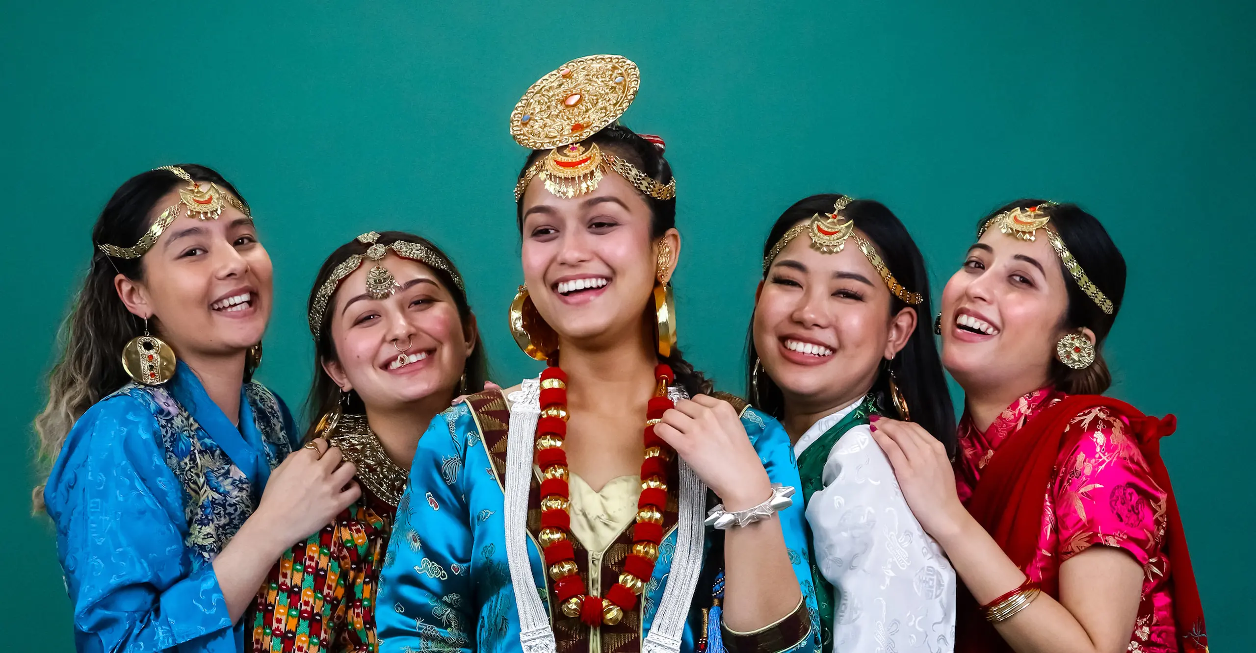 Photograph of a group of women wearing traditional Nepalese clothing and accessories.