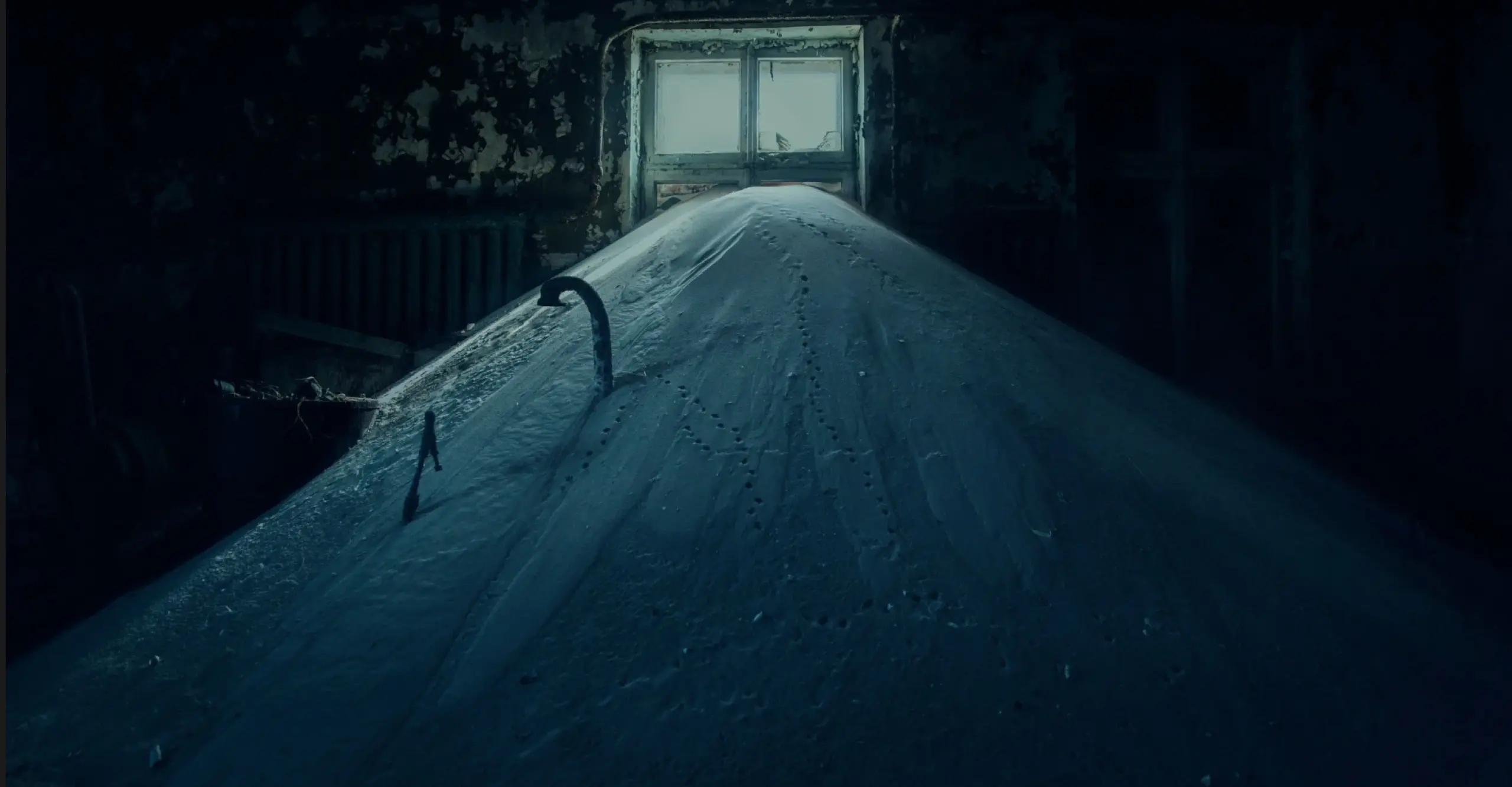 Mound of snow held indoors with small window in background