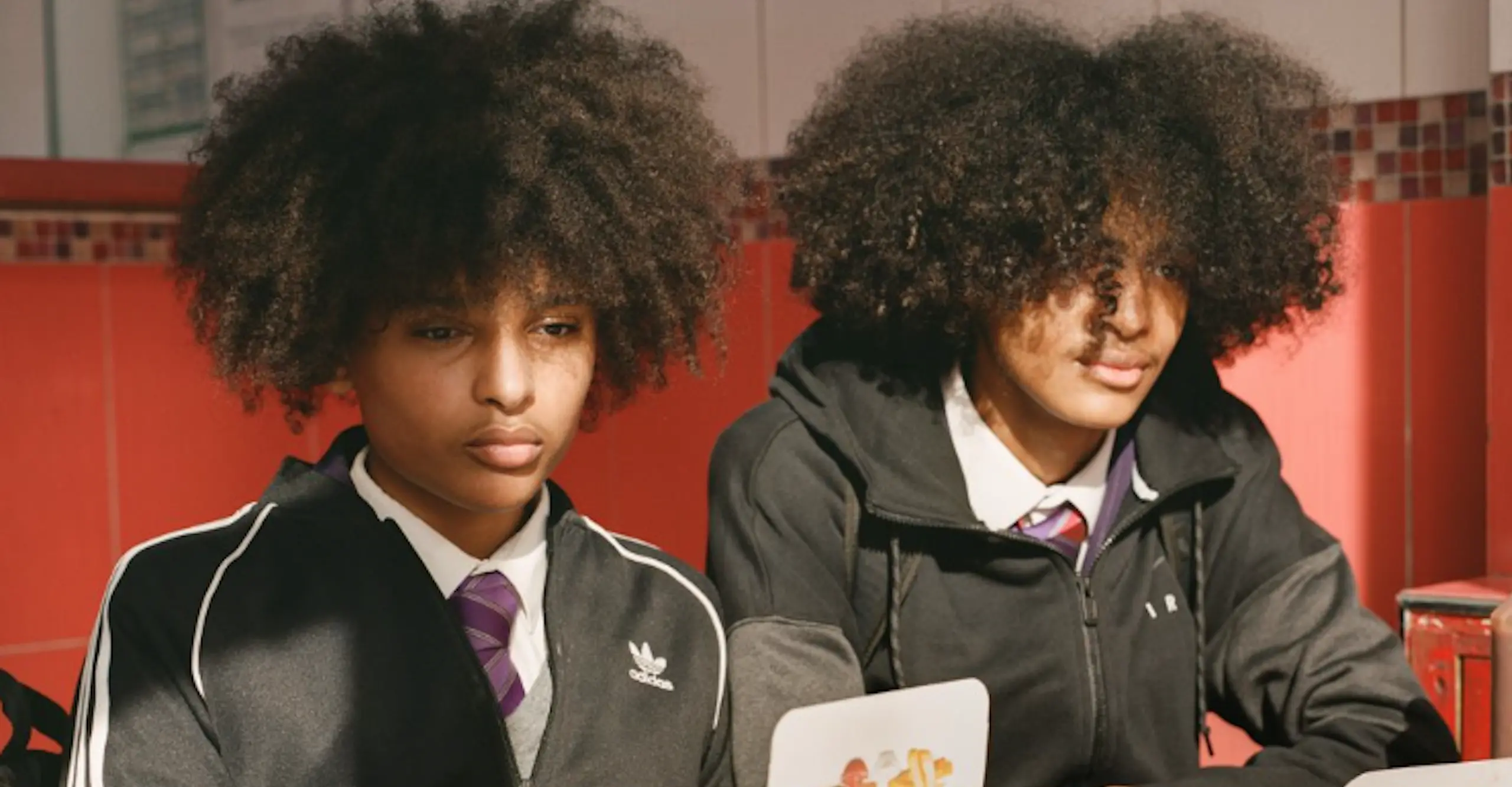 Photograph of two boys in chicken shop.