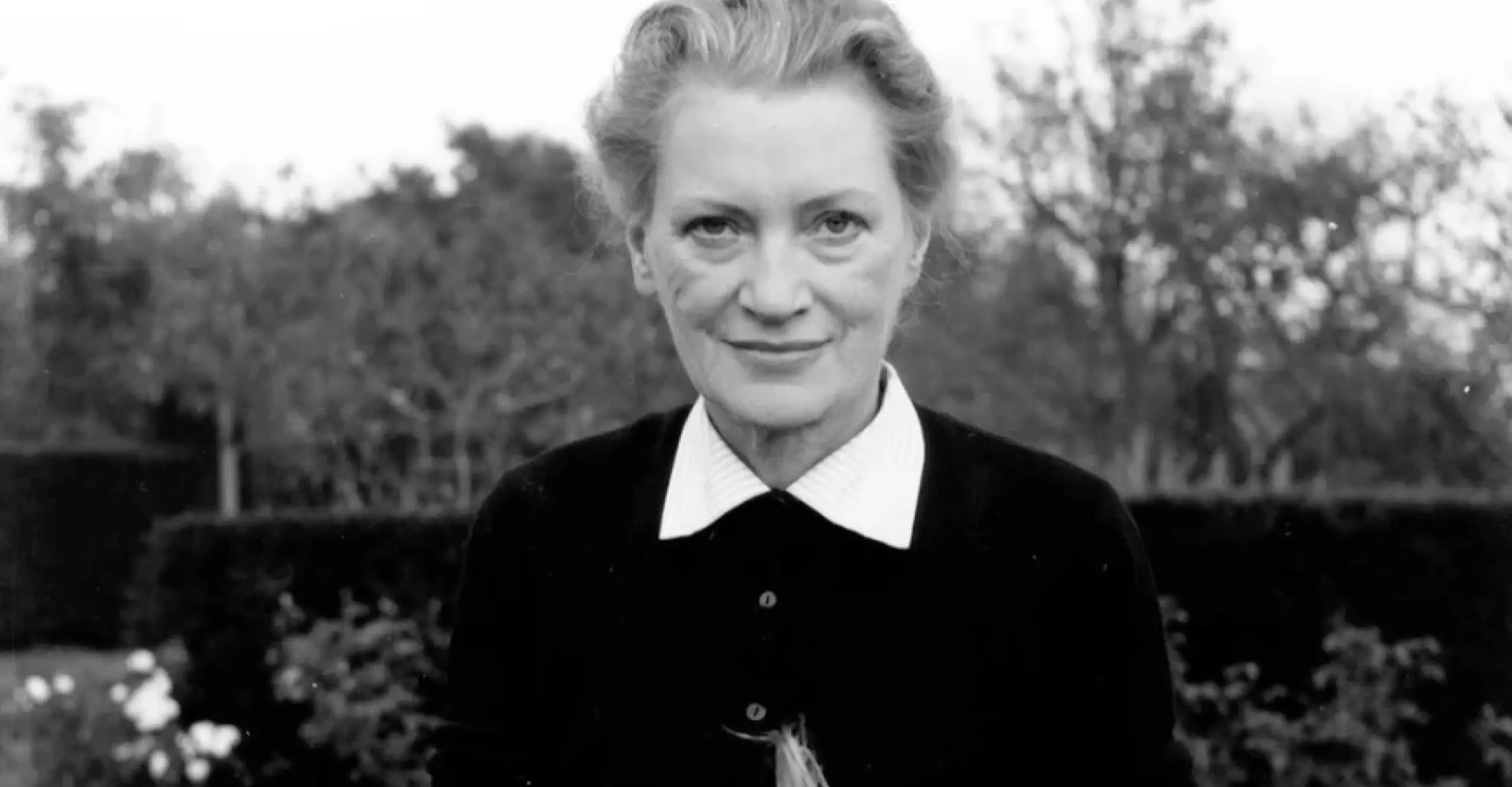 Lee Miller dehusking corn, Farleys Garden, East Sussex, England c1960 by Roland Penrose