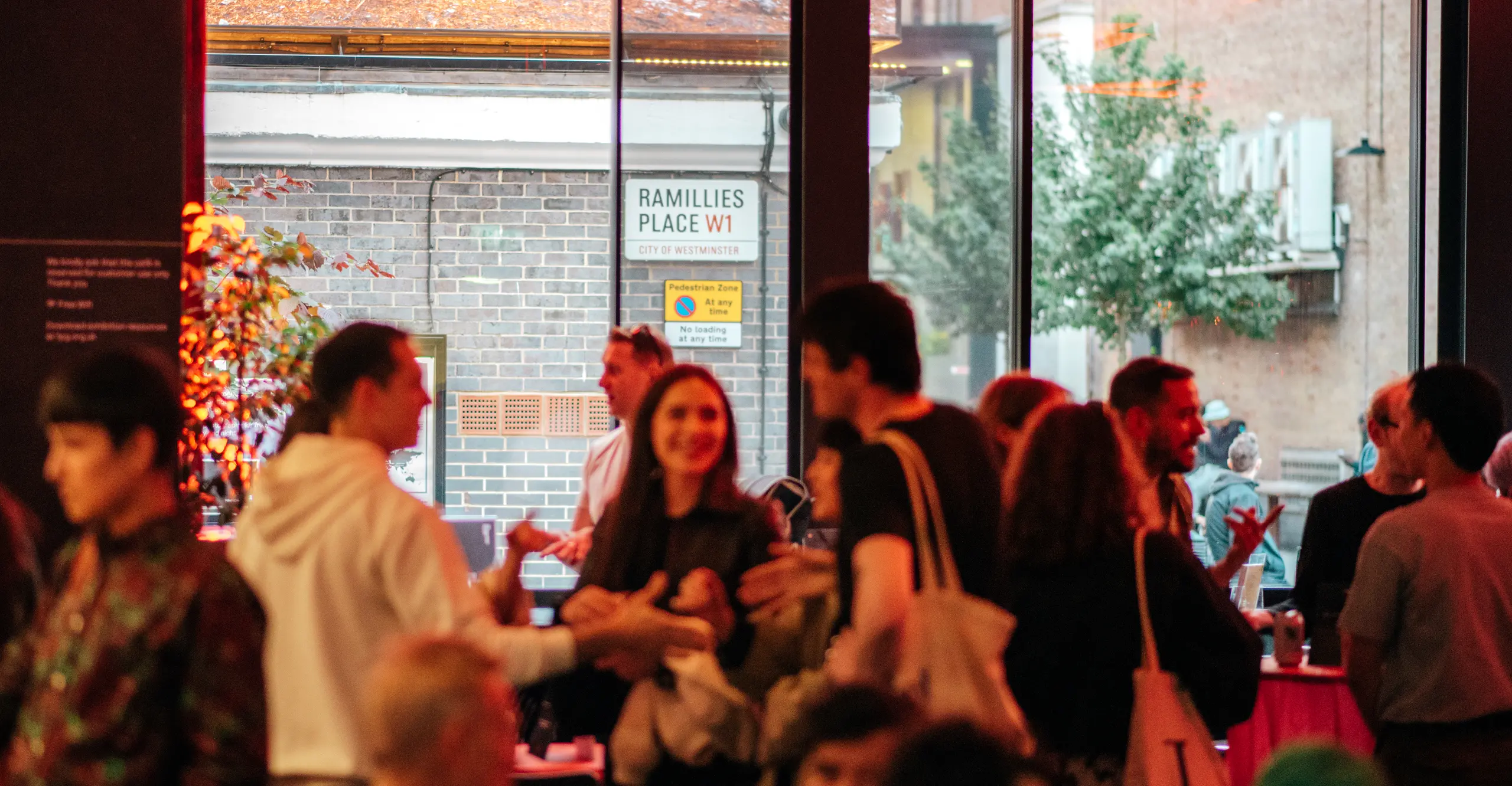 A group of people enjoying themselves at an event in The Photographers' Gallery café bar